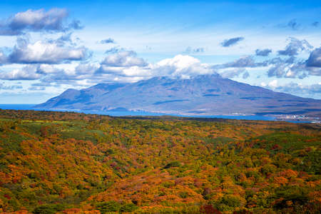 Iturup, Bogdan Khmelnitsky volcano against the background of an autumn forest. Kurile islandsの写真素材