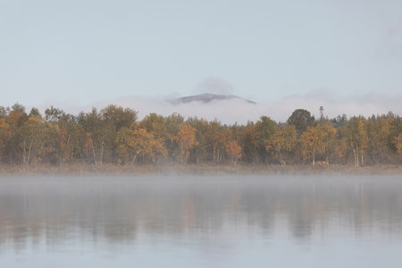 Beautiful autumn landscape with the fog and river. Russiaの写真素材