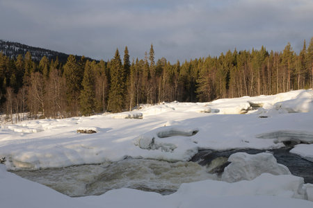 Winter landscape with a waterfall and snow. Russia, Kareliaの写真素材