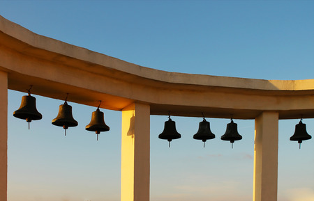 Arch with bells on blue sky backgroundの写真素材