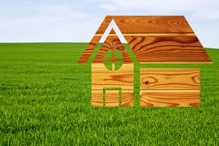 House drawn on a background of grass blue skyの写真素材