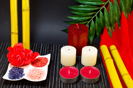 Still life of candle and bath salt with a decoration of roses and bambooの写真素材