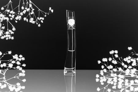 Flacon of perfume with reflection in black and white colorsの写真素材