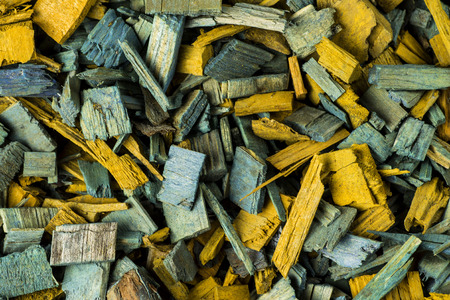 Background of blue and yellow wood chipsの写真素材