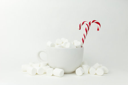 Marshmallow in the cup on the white backgroundの写真素材