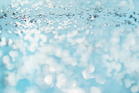 Glitter stars on blue background, sparkles of starsの写真素材
