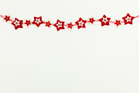 Christmas background with red wreath of starsの写真素材