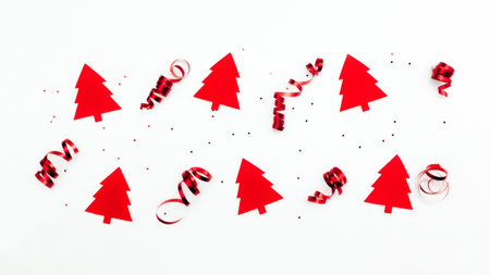 Christmas trees with red ribbons and glitter stars on white backgroundの写真素材