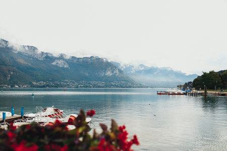 Annecy lake view from Annecy city, red flowersの写真素材
