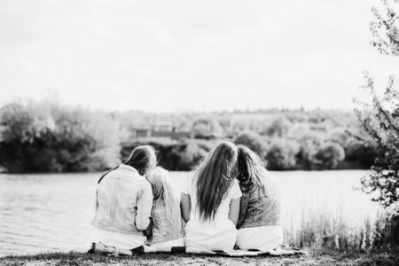 Parents with two kids in outdoorの写真素材