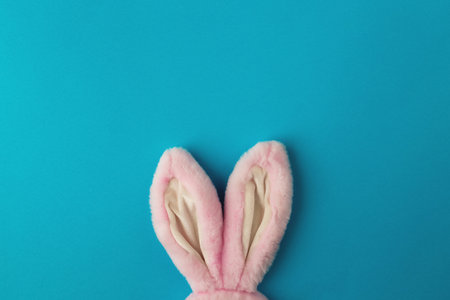 Pink Easter bunny ears on the blue backgroundの写真素材