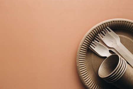 Various eco-friendly kraft paper packaging, fork, cup and plate, containers for takeaway food. Zero waste and recycling concept. High quality photoの写真素材