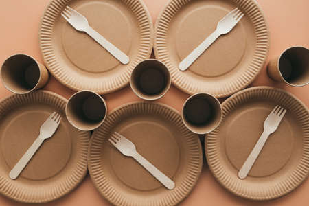 Various eco-friendly kraft paper packaging, fork, cup and plate, containers for takeaway food. Zero waste and recycling concept. High quality photoの写真素材