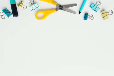 Paper clips, marker and pencil, scissors on white background. Work and education concept. High quality photoの写真素材