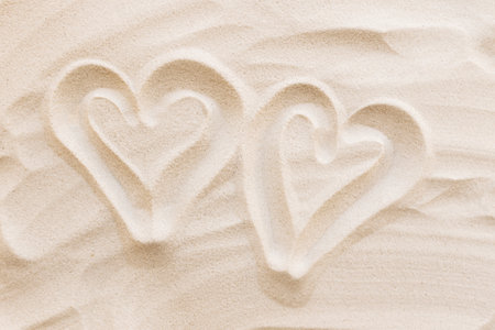 Travel, vacation, honey moon concept. Heart shapes on the sand. Love for two. High quality photoの写真素材