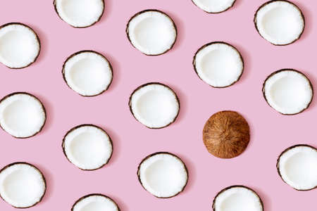 Coconut pattern on the pink background. Set of coconut halves. High quality photoの写真素材