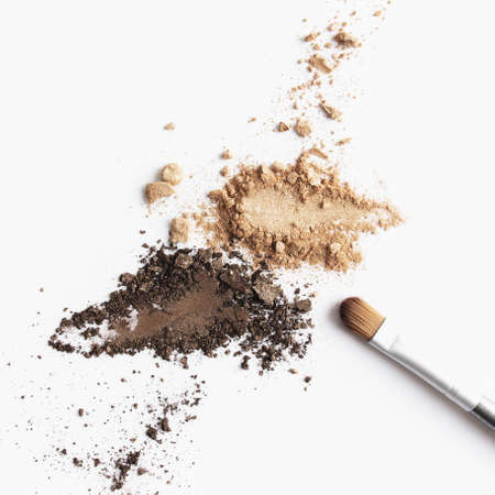 Scattered light and dark brown face shadow and eye shadow or make-up brushの写真素材