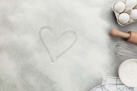 Baking concept flat lay. Ingredients, kitchen utensils, grey concrete backgroundの写真素材