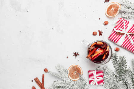 Christmas flat lay top view with glass cup of Mulled Wine, gift box, decorationsの写真素材