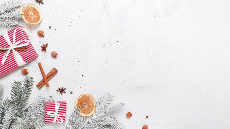 Christmas flat lay top view on white gray concrete background table with glass cup or mug of Mulled...