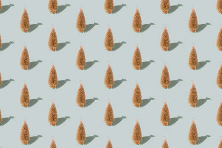 Gray green background pattern, Christmas, New Year small toy golden fir treesの写真素材