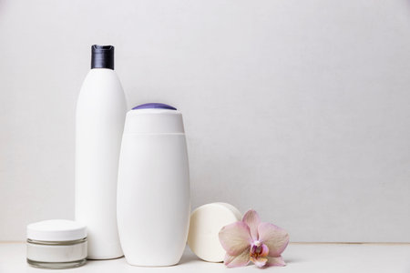Preparation for spa, home bath procedure. Bathroom accessories, cosmetic on washbasin shelf....