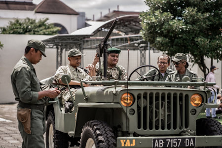 little boy playing with guns and learning the history of warfare march 1st general attack. : Yogyakarta, Indonesia - 01 March 2022のeditorial素材