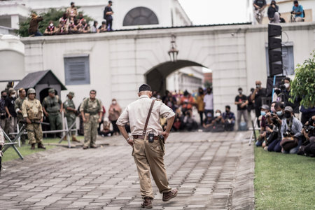 theatrical war general attack 1 march, using war uniforms and weapons in the Dutch colonial era. They shoot each other. : Yogyakarta, Indonesia - 01 March 2022のeditorial素材