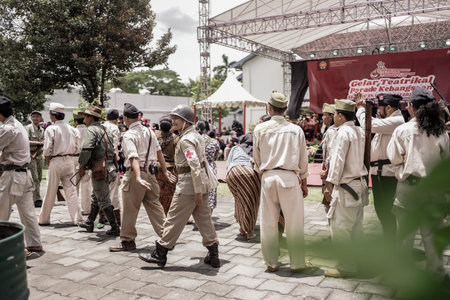 theatrical war general attack 1 march, using war uniforms and weapons in the Dutch colonial era. They shoot each other. : Yogyakarta, Indonesia - 01 March 2022のeditorial素材