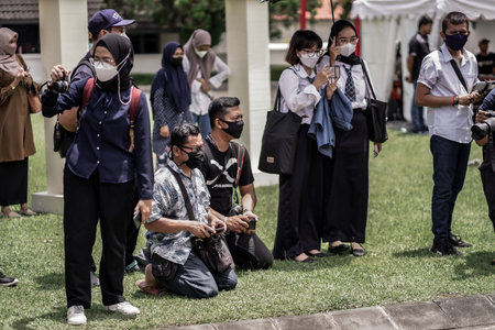 theatrical war general attack 1 march, using war uniforms and weapons in the Dutch colonial era. They shoot each other. : Yogyakarta, Indonesia - 01 March 2022のeditorial素材