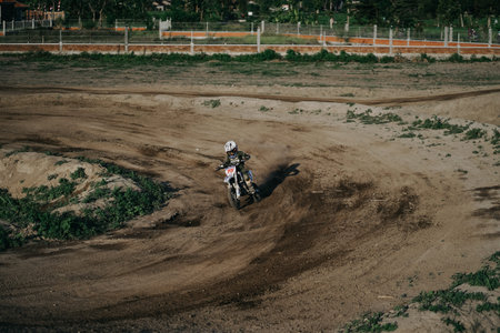 the motocross riders practice together to improve their skills on the Sultan Agung circuit. :...