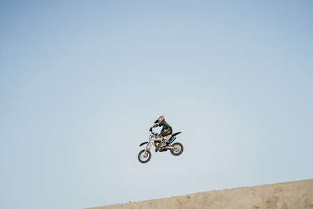 A scene of a motocross rider jumping beautifully during practice at the Sultan Agung circuit. : Bantul, Indonesia - 11 August 2021のeditorial素材