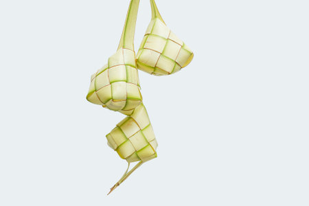 The process of making ketupat is a traditional food during Eid. Put the rice in the ketupat container.の写真素材