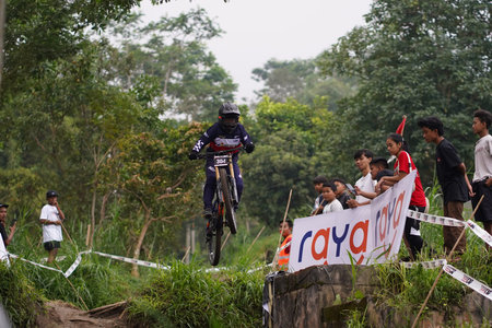 Downhill Bike Festival in Yogyakarta Teras CAF. A participant in the Mountain Bike Festival cycles...