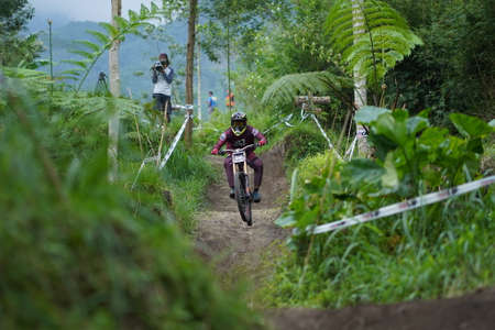 Downhill Bike Festival in Yogyakarta "Teras CAF". A participant in the Mountain Bike Festival who is preparing to compete. : Sleman, Indonesia - 28 May 2022のeditorial素材