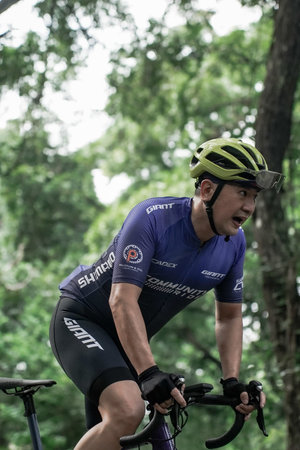 A group of road bike athletes from Mula and Nusantara pro cycling competed on the road, preparing...