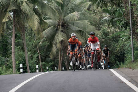style and expression of road bike cyclists when passing uphill routes, preparing for the test route for the Tour de ambarrukmo 2022. : Sleman, Indonesia - 21 May 2022のeditorial素材