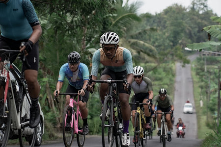 Expression and style of professional road bike cyclists through the downhill route, preparing for...