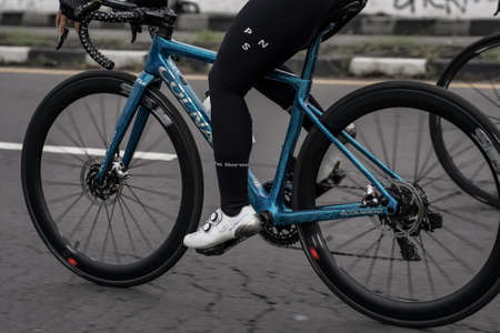 Cycling using a road bike with friends, preparing for a test route for the Tour de ambarrukmo 2022. : Sleman, Indonesia - 21 May 2022のeditorial素材