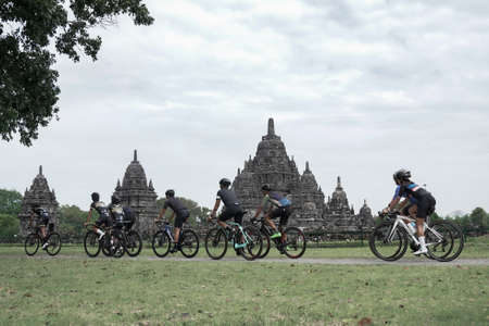 A group of fast-paced road bike cyclists crossed the iconic Kulon progo border and prepared a test route for the Tour de ambarrukmo 2022. : Sleman, Indonesia - 21 May 2022のeditorial素材