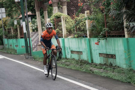 Cycling on the road using a road bike. : Sleman, Indonesia - 21 May 2022のeditorial素材