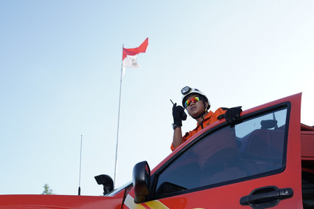 A brave Basarnas rescue team stands tall carrying Handy Talky to communicate. : Yogayakarta,...