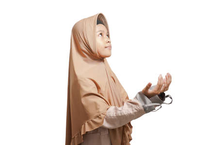 a girl wearing a hijab, wearing a brown Muslim dress which gives an ok sign if she agrees. white backgroundの写真素材