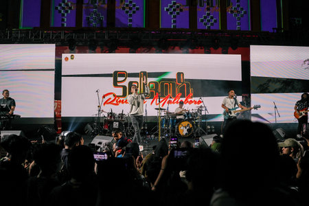 Music Festival. The performance of Jikustik, a band from Yogyakarta. The audience cheers and enjoys the music. : Yogyakarta, Indonesia - 07 September 2022のeditorial素材