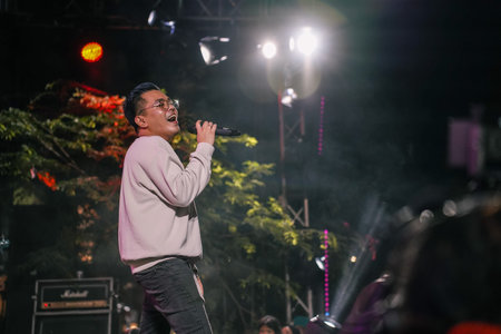 Music Festival. The performance of Jikustik, a band from Yogyakarta. The audience cheers and enjoys...