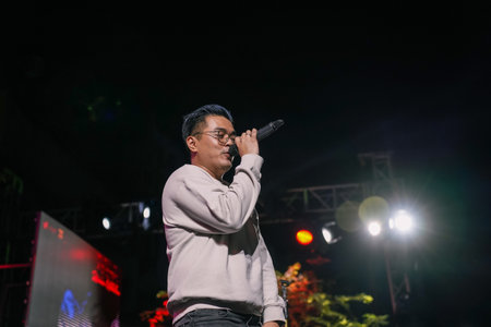 Music Festival. The performance of Jikustik, a band from Yogyakarta. The audience cheers and enjoys the music. : Yogyakarta, Indonesia - 07 September 2022のeditorial素材