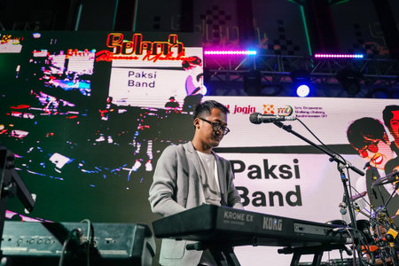 Music Festival. The performance of Jikustik, a band from Yogyakarta. The audience cheers and enjoys the music. : Yogyakarta, Indonesia - 07 September 2022のeditorial素材