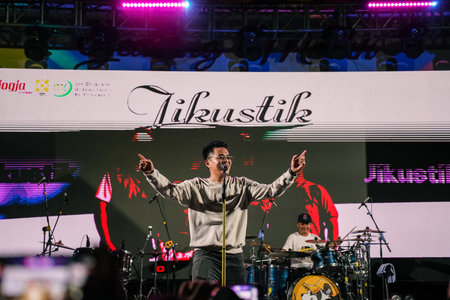 Music Festival. The performance of Jikustik, a band from Yogyakarta. The audience cheers and enjoys the music. : Yogyakarta, Indonesia - 07 September 2022のeditorial素材