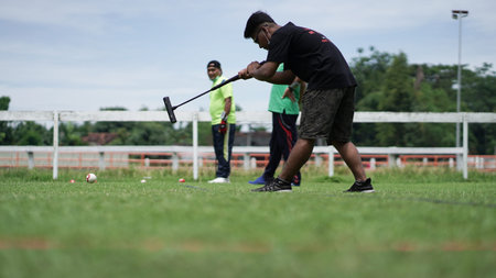 Playing Gateball in an open space at the Sultan Agung stadium. . : BANTUL, Indonesia - 28 February...