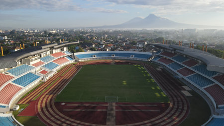 Aerial view, Mandala Krida Stadium with the background of Mount Merapi in the morning. : Yogyakarta, Indonesia - 17 April 2021のeditorial素材